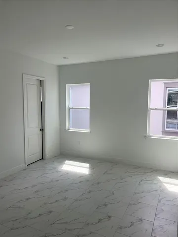 an empty room with windows