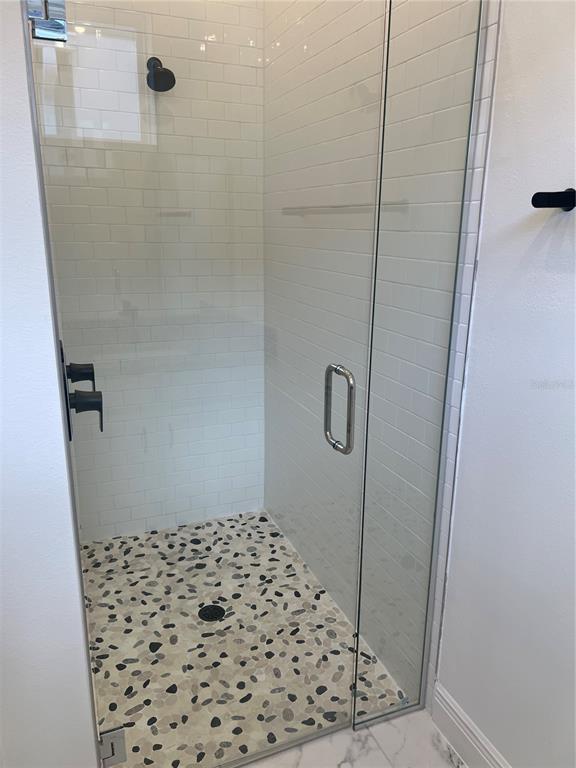 10171 Pearson Avenue Orlando, FL 32827 - Photo 14 of 16 a bathroom with a shower