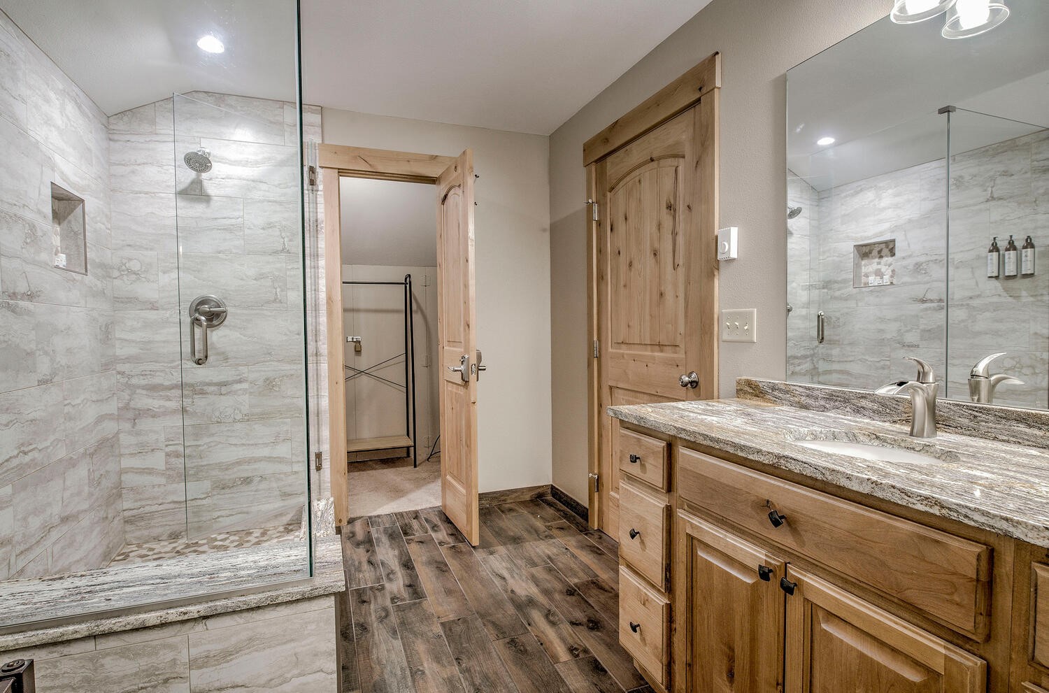 41 Washington Lode Breckenridge, CO 80424 - Photo 19 of 35 a bathroom with a granite countertop sink mirror and shower