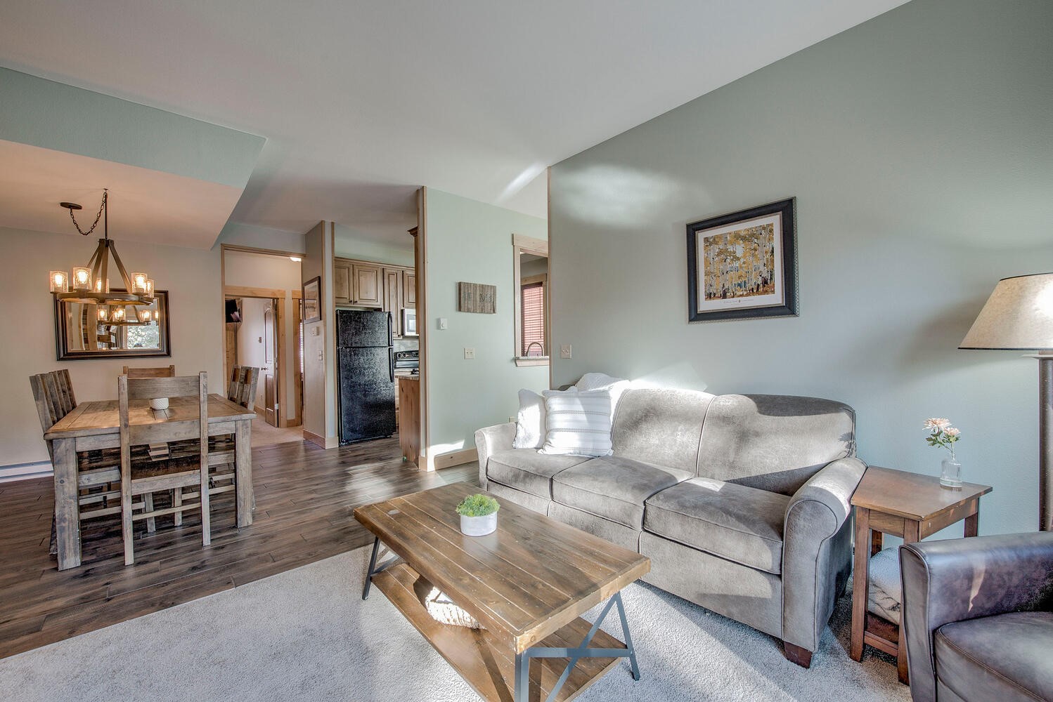 41 Washington Lode Breckenridge, CO 80424 - Photo 3 of 35 a living room with furniture a dining table and kitchen view
