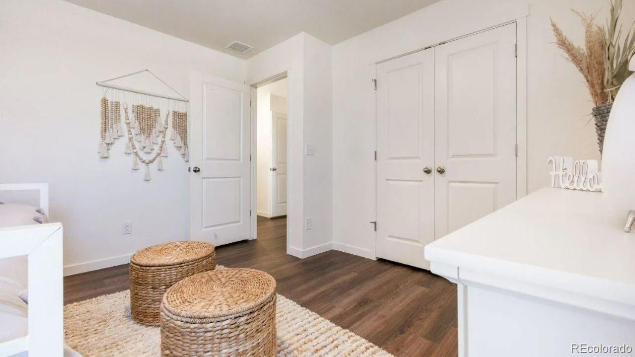 831 South Apex Avenue Fort Lupton, CO 80621 - Photo 14 of 18 a bathroom with a granite countertop sink and a toilet
