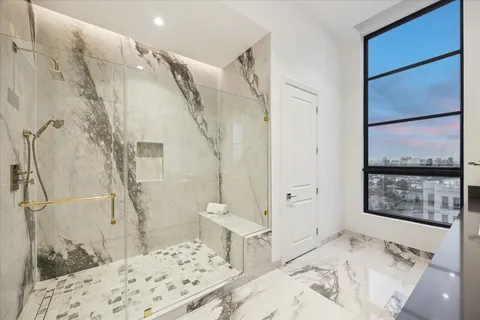 a bathroom with a bathtub and shower
