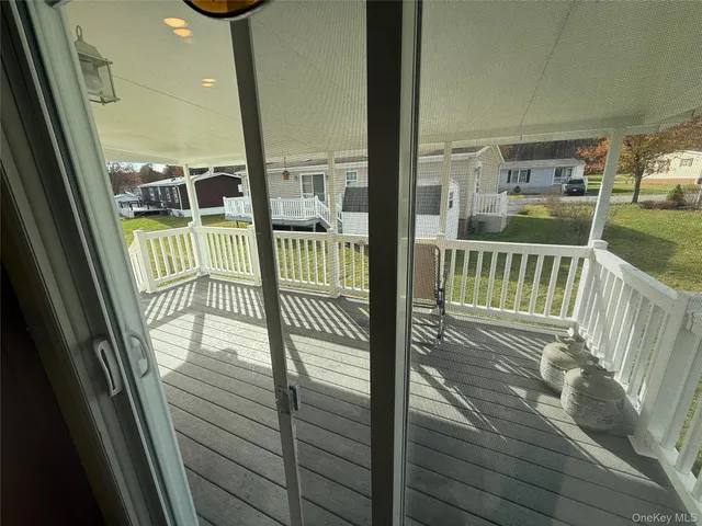 a view of balcony with furniture