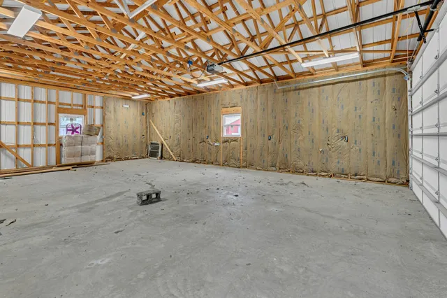 a view of a backyard with sitting area