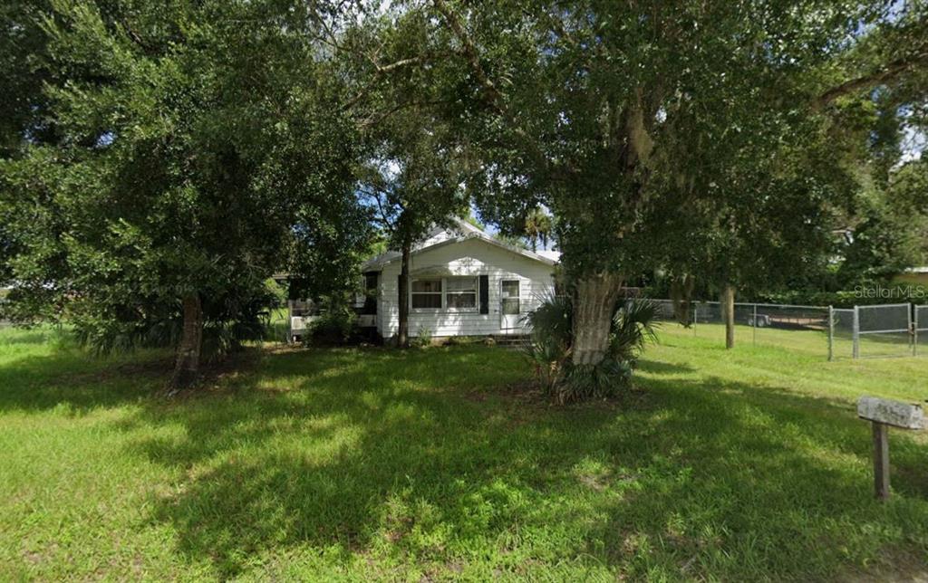 a house view with a garden space