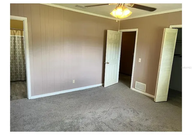 a view of an empty room with a window