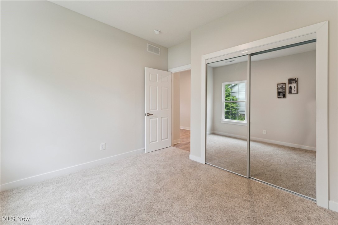7605 Lake Road East Madison, OH 44057 - Photo 34 of 50 Office/bedroom with carpet floors, a closet, and baseboards