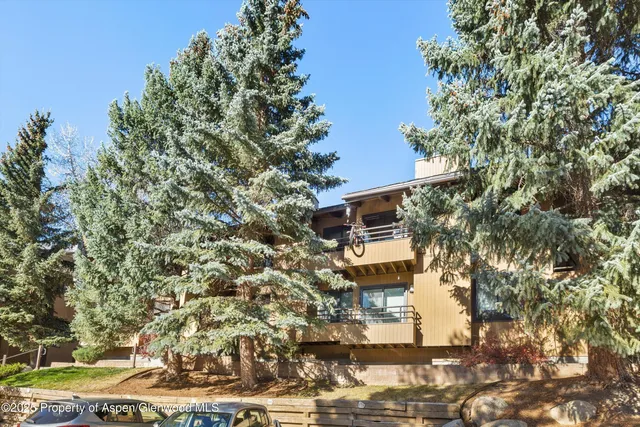 a aerial view of a house with a yard