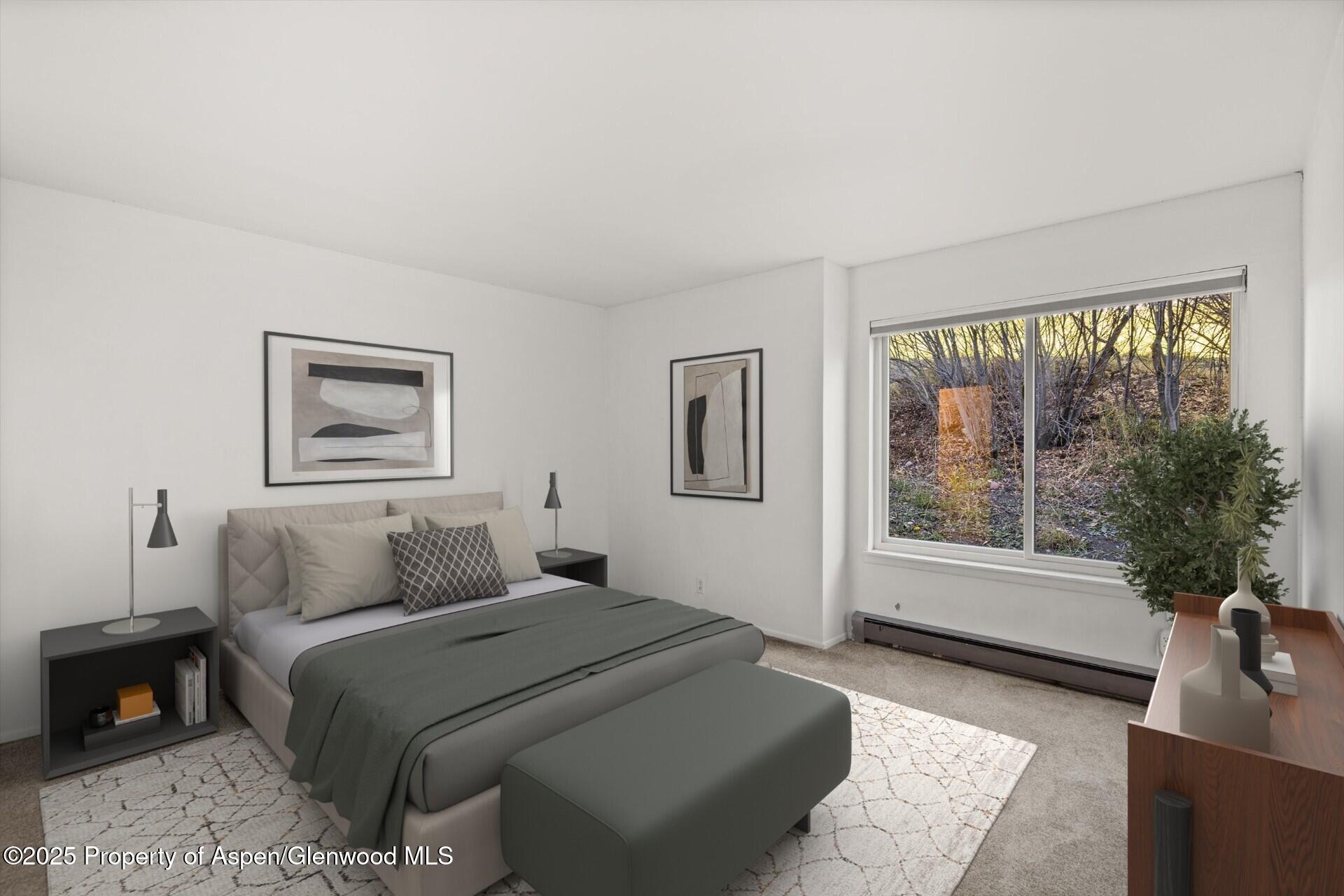 35 Lower Woodbridge Road, Unit V/177 Snowmass Village, CO 81615 - Photo 10 of 15 a bedroom with a large bed and a window with outer view