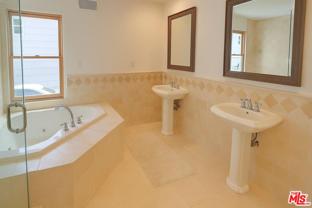 3873 Beverly Ridge Drive Sherman Oaks, CA 91423 - Photo 12 of 15 a bathroom with a sink and a bathtub