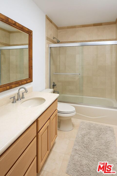 3873 Beverly Ridge Drive Sherman Oaks, CA 91423 - Photo 13 of 15 a bathroom with a sink and a mirror