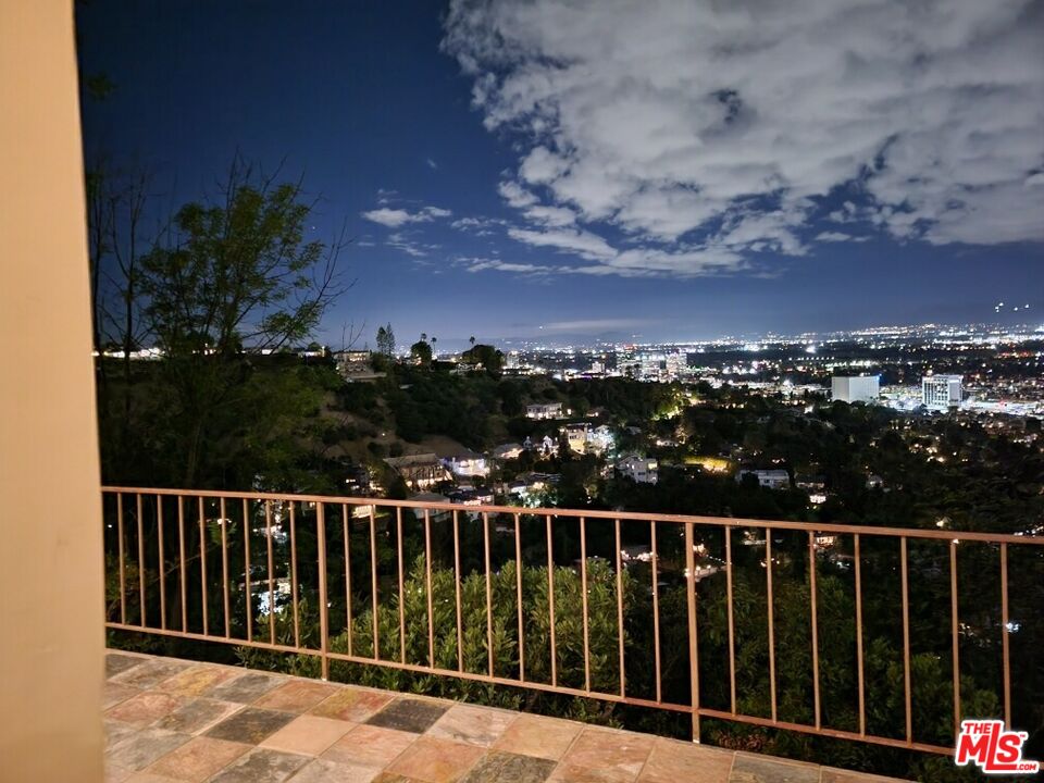 3873 Beverly Ridge Drive Sherman Oaks, CA 91423 - Photo 3 of 15 a balcony with a view of lake