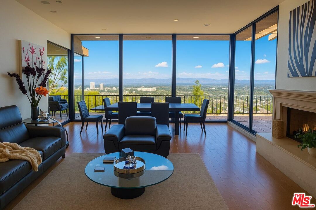 3873 Beverly Ridge Drive Sherman Oaks, CA 91423 - Photo 4 of 15 a view of a dining room with furniture one side kitchen view and a fireplace