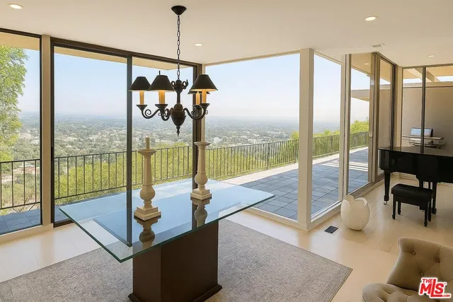 a view of living room with furniture and floor to ceiling window