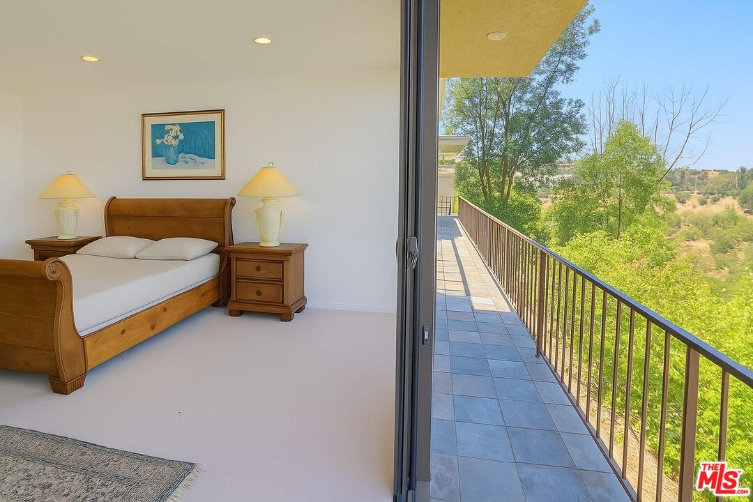 3873 Beverly Ridge Drive Sherman Oaks, CA 91423 - Photo 9 of 15 a view of a bedroom with furniture and wooden floor