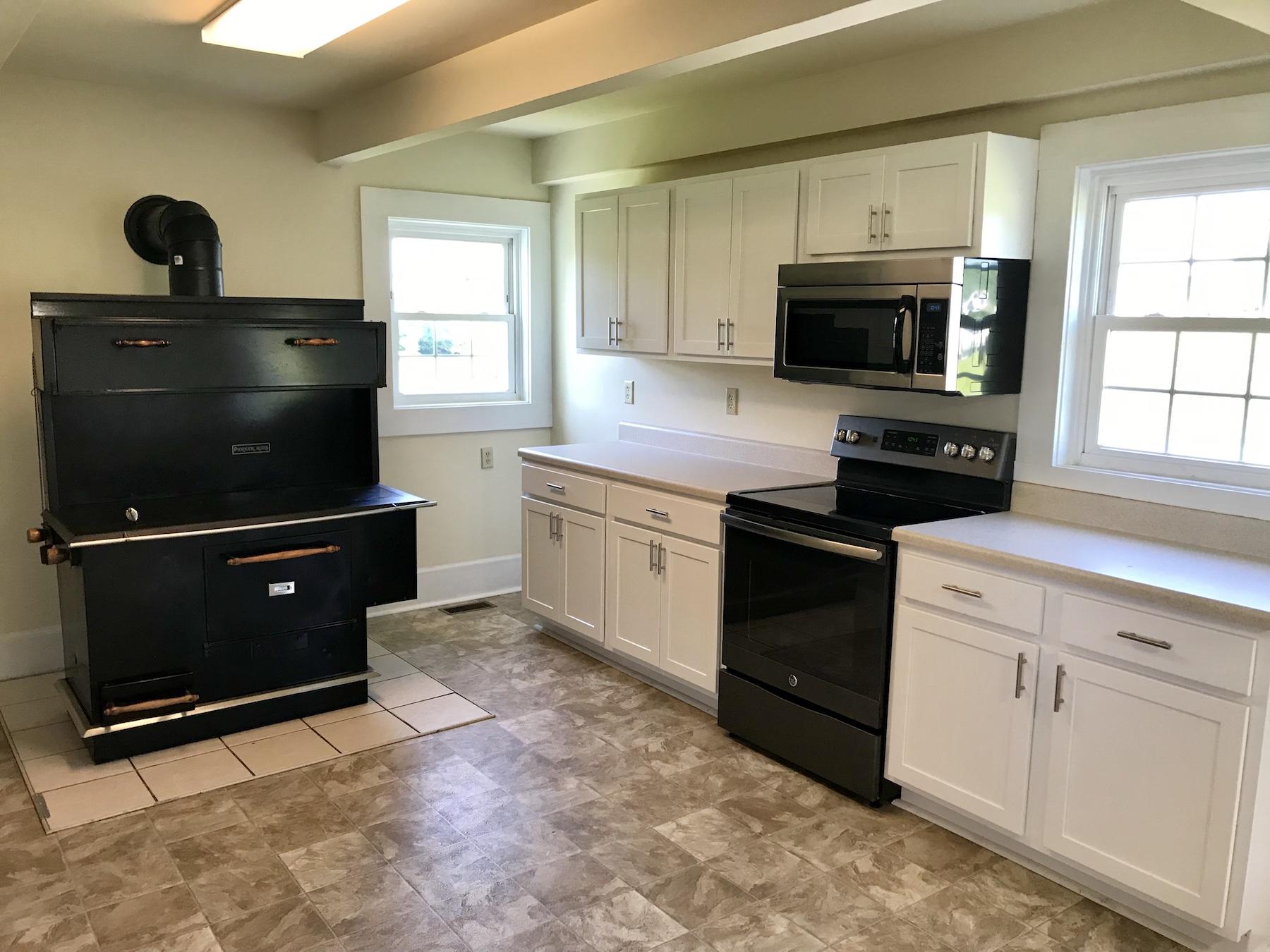 2503 Huffville Road Pilot, VA 24138 - Photo 12 of 26 a kitchen with stainless steel appliances a stove a microwave and a sink