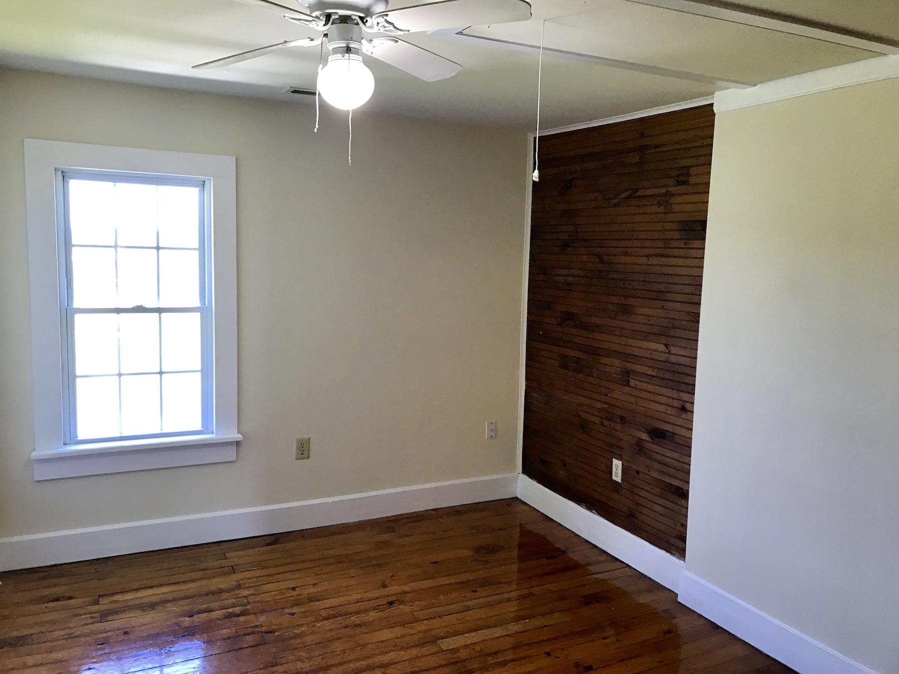 2503 Huffville Road Pilot, VA 24138 - Photo 7 of 26 a view of an empty room with wooden floor and a window