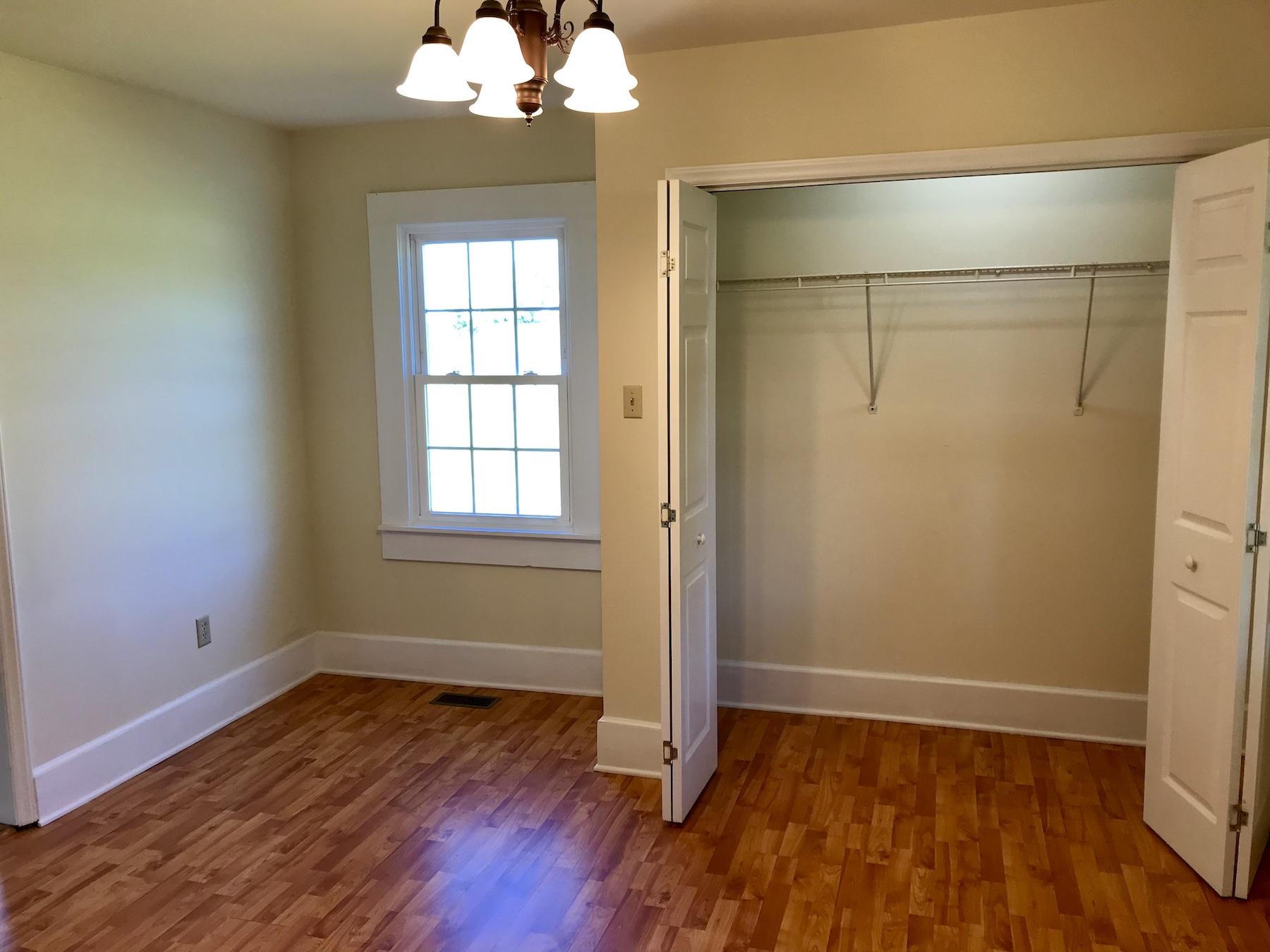 2503 Huffville Road Pilot, VA 24138 - Photo 9 of 26 a view of an empty room with wooden floor and a window