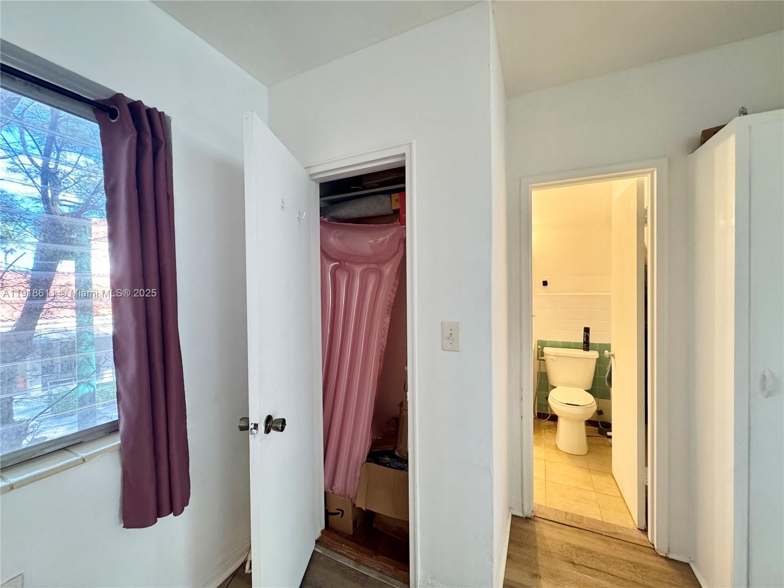 4740 Pine Tree Drive, Unit 32 Miami Beach, FL 33140 - Photo 14 of 20 a view of a bathroom from a hallway