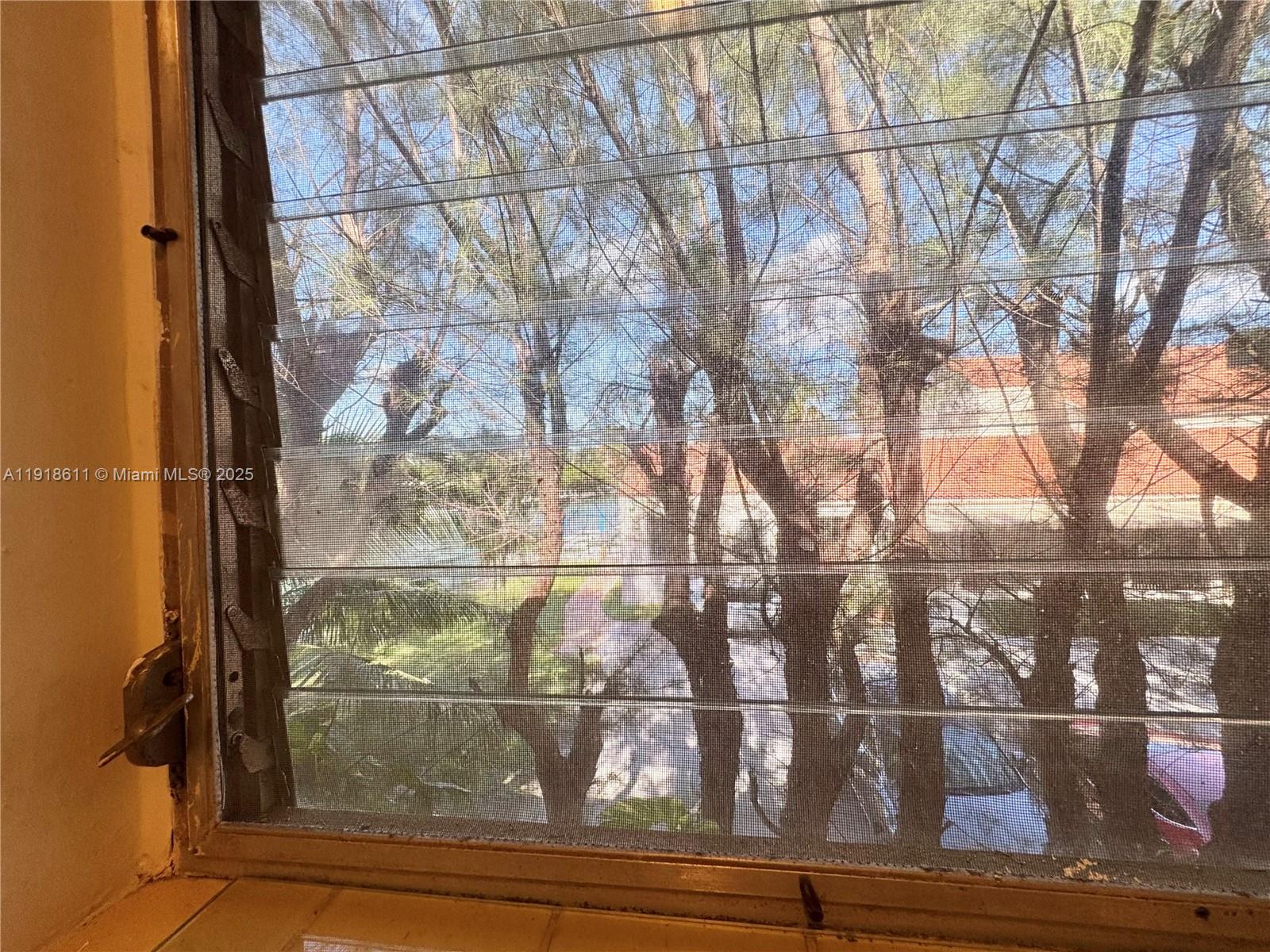 4740 Pine Tree Drive, Unit 32 Miami Beach, FL 33140 - Photo 19 of 20 a view of a wooden door