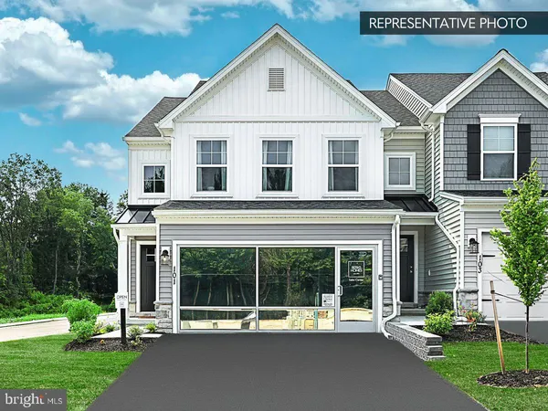 a view of a house with a yard and plants