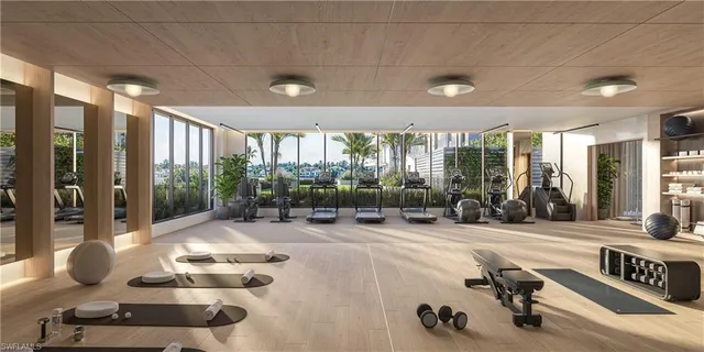a room with gym equipment and a large window