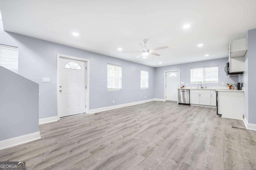 1909 Dannenberg Avenue Macon, GA 31201 - Photo 10 of 55 a view of an empty room with kitchen and window