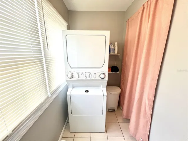 a bathroom with a toilet sink and a window