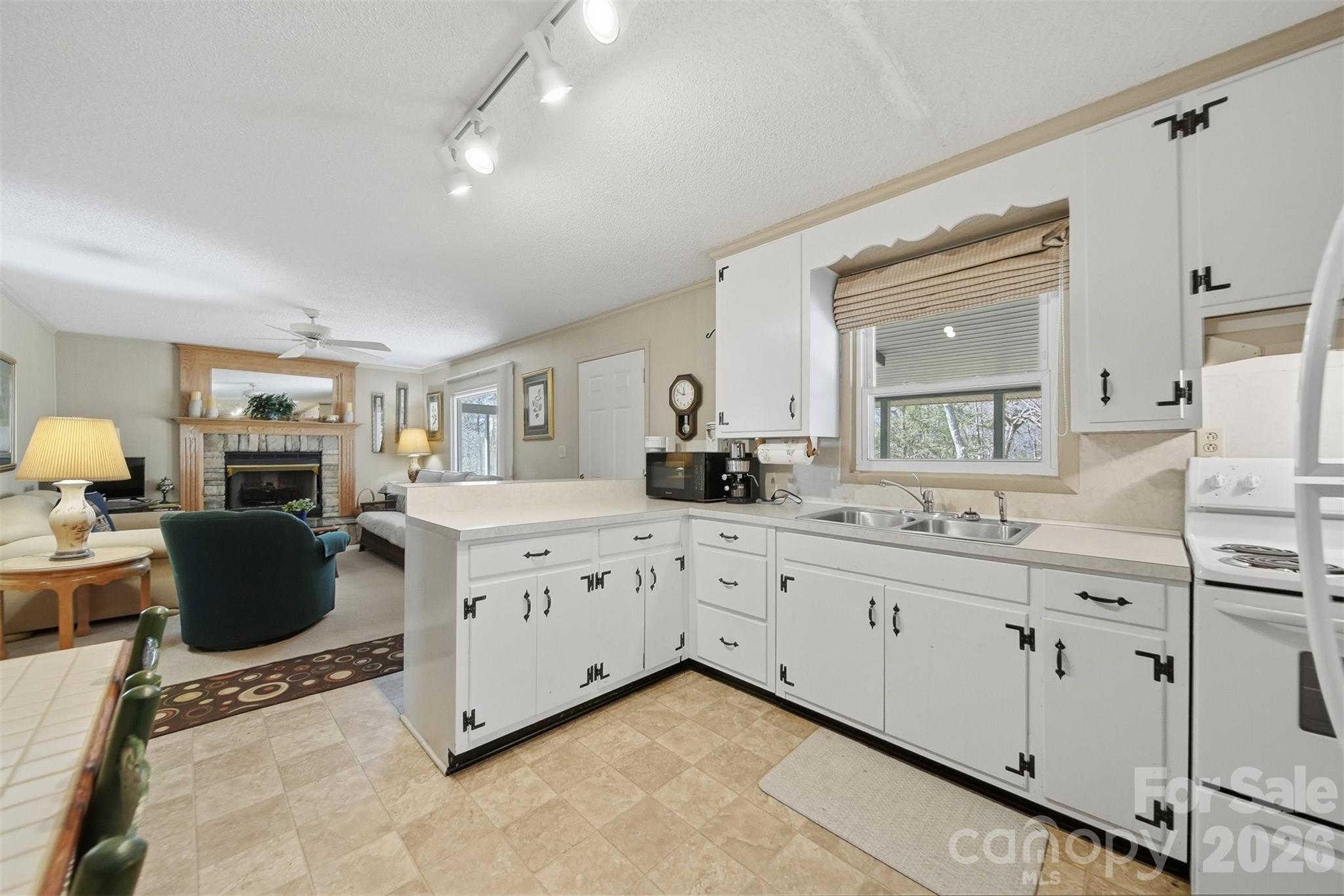 7218 Martin Road Newland, NC 28657 - Photo 12 of 27 a large white kitchen with cabinets