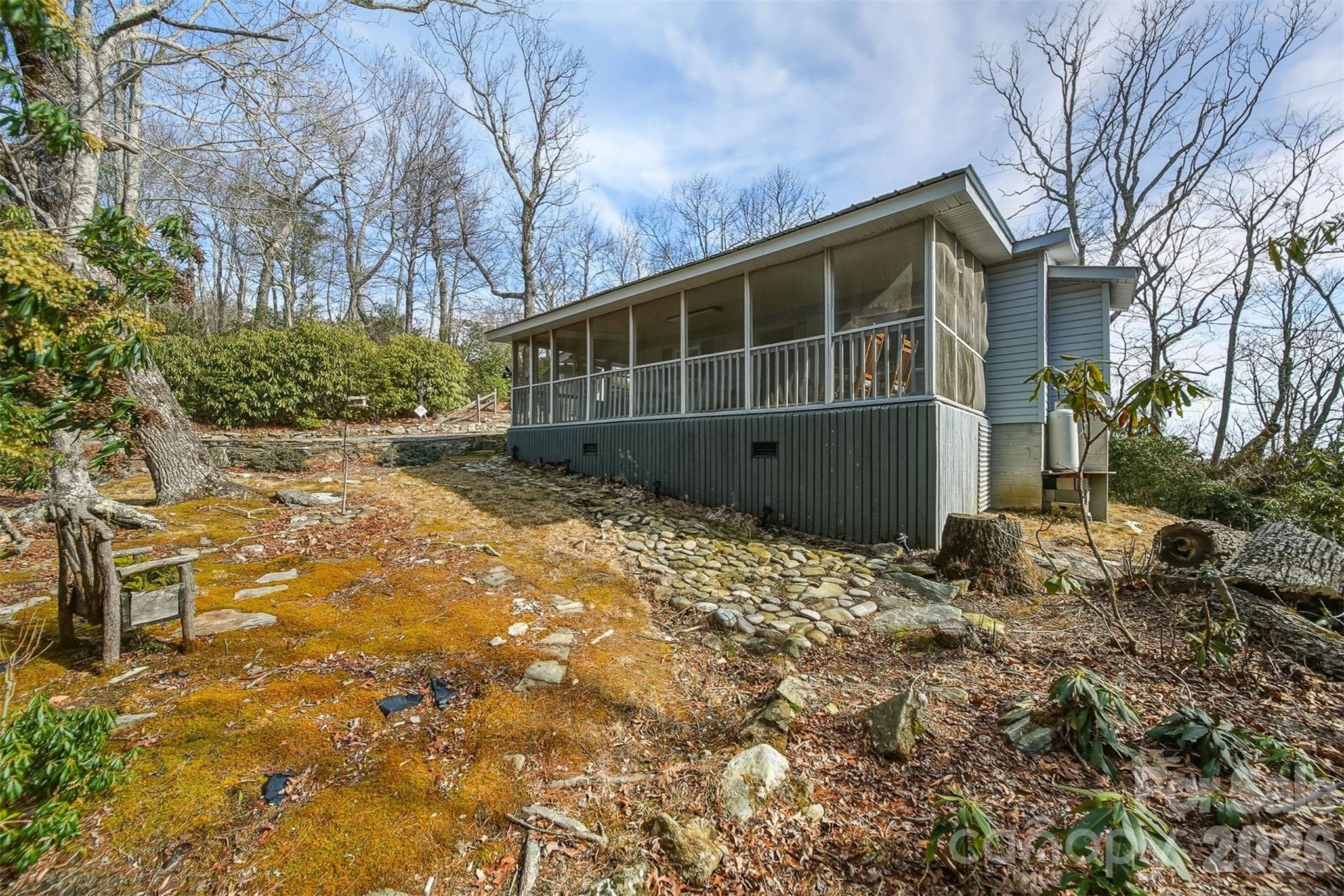 7218 Martin Road Newland, NC 28657 - Photo 20 of 27 a view of a house with a yard