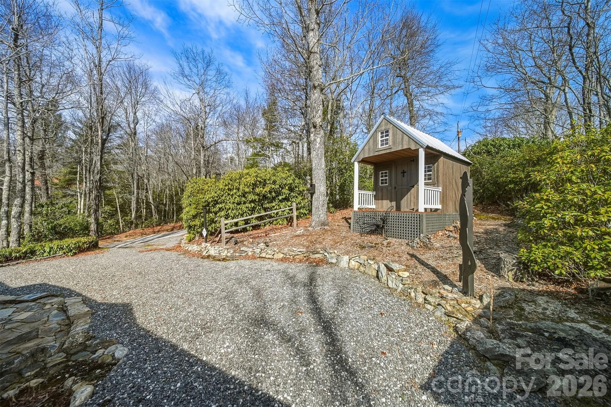 7218 Martin Road Newland, NC 28657 - Photo 22 of 27 a front view of a house with garden
