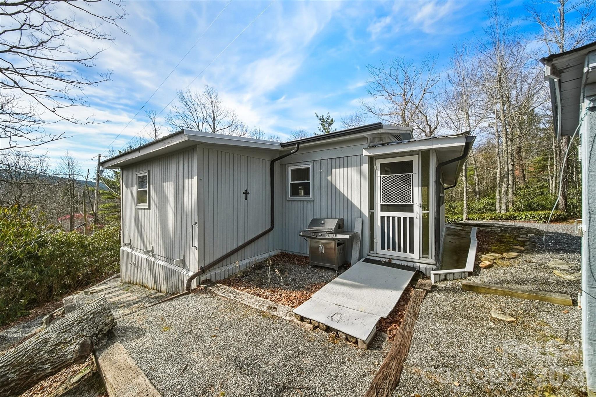 7218 Martin Road Newland, NC 28657 - Photo 24 of 27 a front view of a house with garden