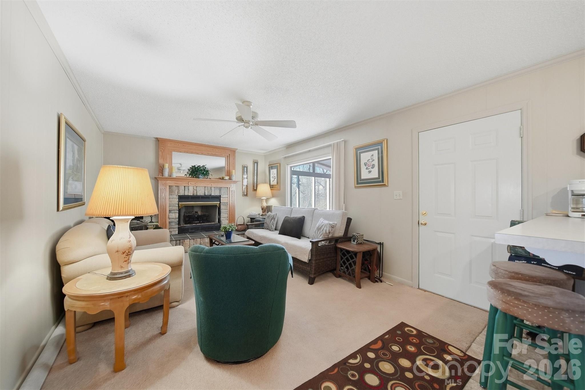 7218 Martin Road Newland, NC 28657 - Photo 8 of 27 a living room with furniture a lamp and a window