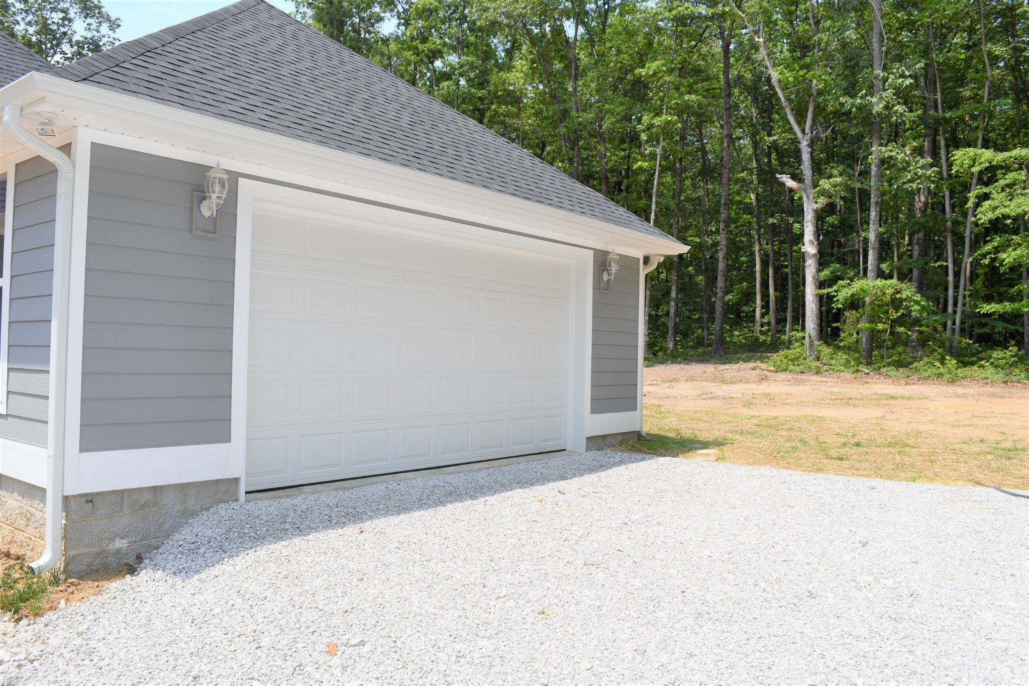 1387 Cooley's Rift Boulevard Monteagle, TN 37356 - Photo 4 of 24 a backyard of a house with garage