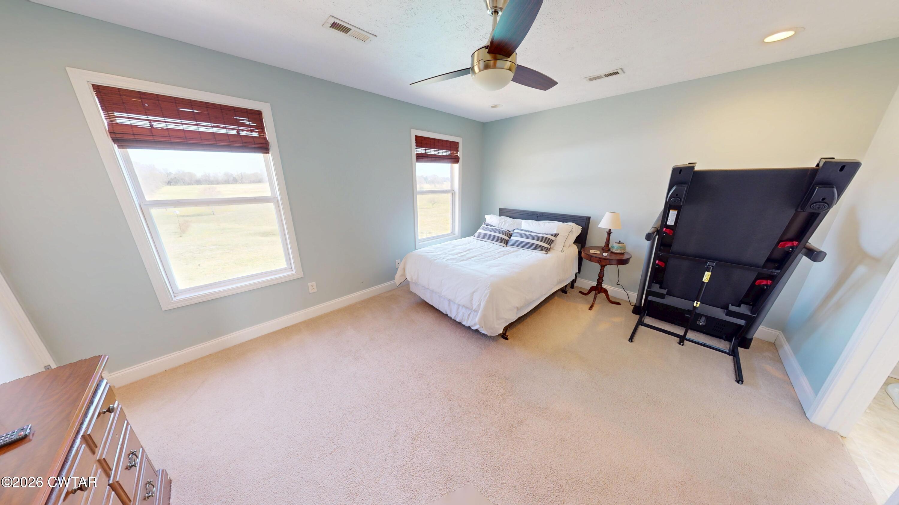 740 Gordon Road Dyersburg, TN 38024 - Photo 32 of 48 a bedroom with bed and a window