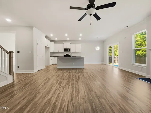 a view of a kitchen with a sink and a window