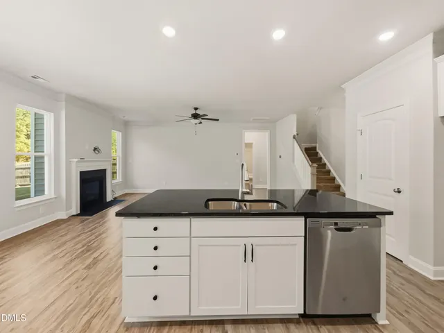 a kitchen with a sink and cabinets