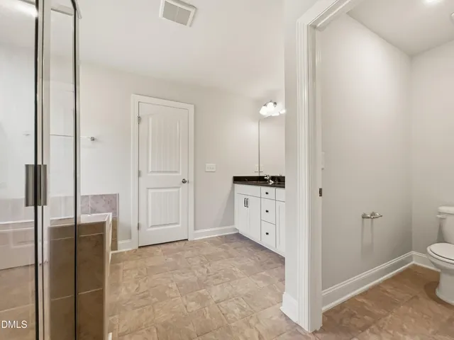 a view of a kitchen with refrigerator