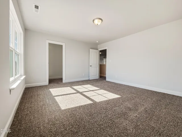 a view of an empty room and window