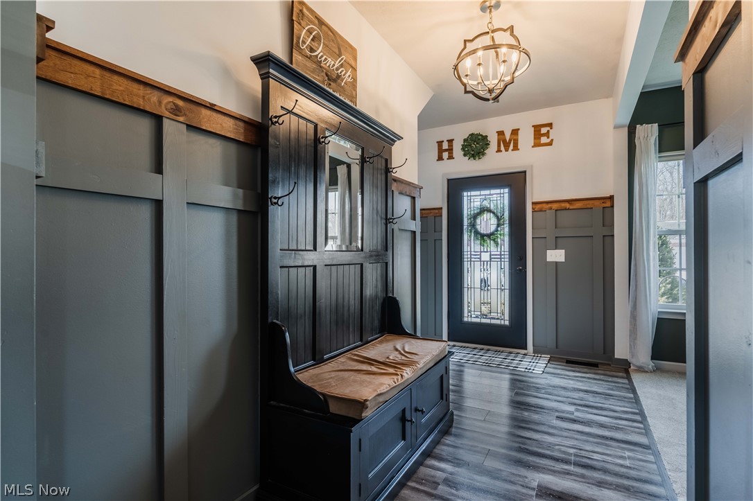 6687 List Street Northwest Canton, OH 44708 - Photo 3 of 21 Mudroom featuring hanging lights and dark wood finished floors