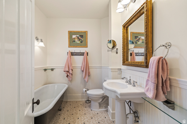390 North 100 West Monroe, UT 84754 - Photo 98 of 167 Full bath featuring a freestanding tub and a wainscoted wall