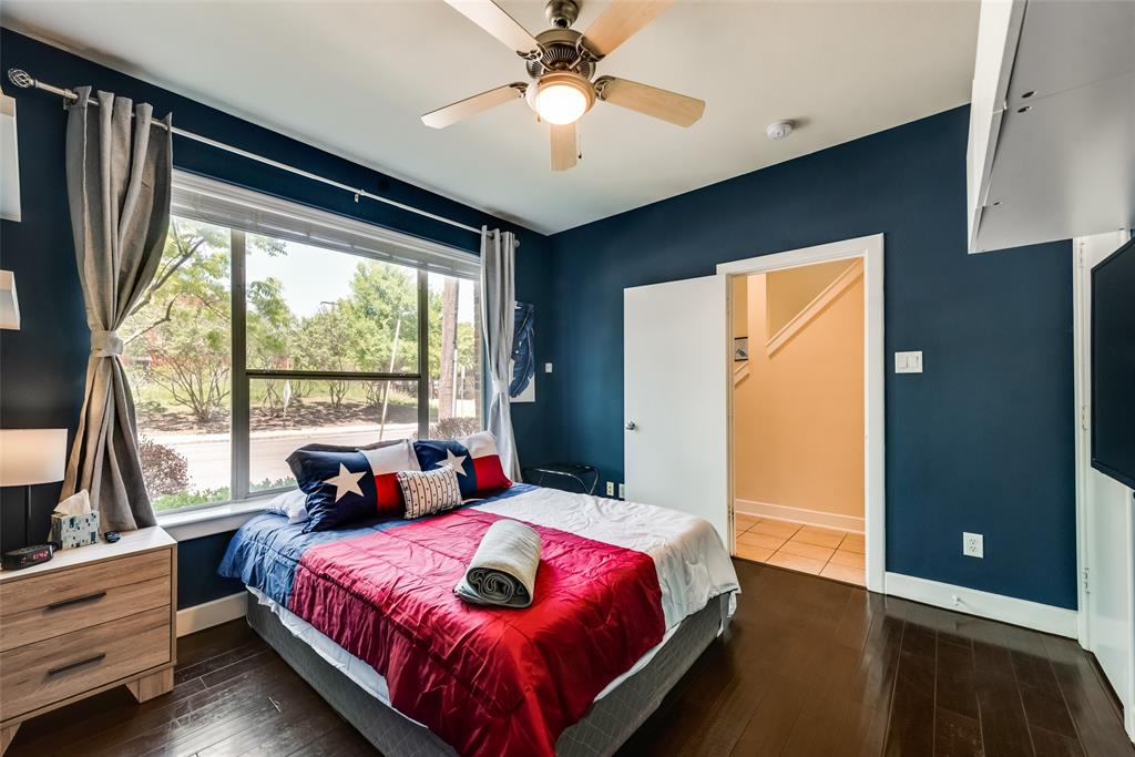 2718 Floyd Street Dallas, TX 75204 - Photo 12 of 25 a bedroom with a bed and a large window
