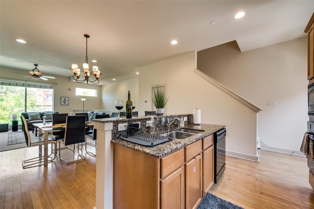 2718 Floyd Street Dallas, TX 75204 - Photo 15 of 25 a kitchen with stainless steel appliances granite countertop a stove and a wooden floors