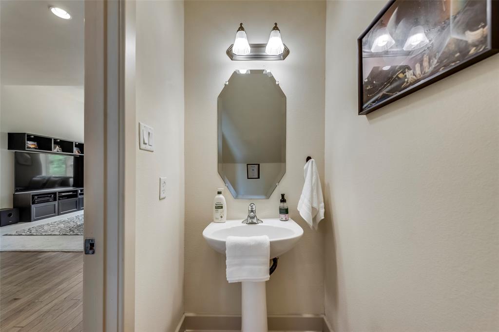2718 Floyd Street Dallas, TX 75204 - Photo 19 of 25 a bathroom with a sink and a mirror