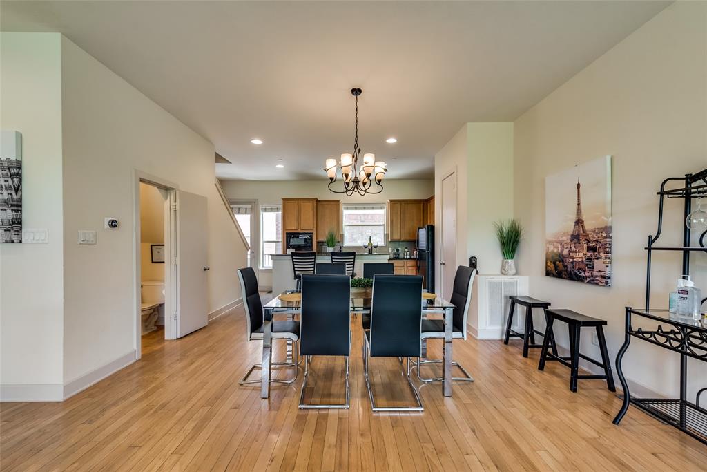 2718 Floyd Street Dallas, TX 75204 - Photo 20 of 25 a view of a dining room with furniture and wooden floor
