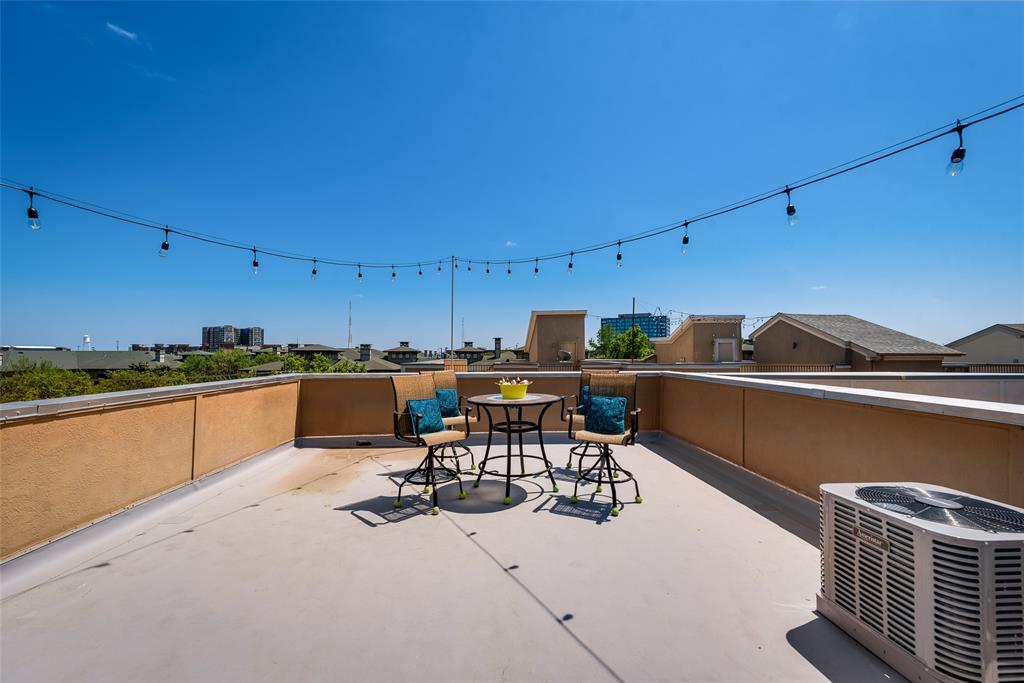 2718 Floyd Street Dallas, TX 75204 - Photo 24 of 25 a kitchen with a table chairs and a stove