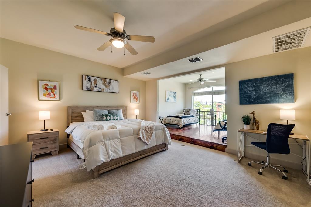 2718 Floyd Street Dallas, TX 75204 - Photo 5 of 25 a bedroom with a bed and a large window