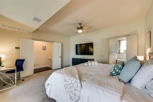 a bed room with a bed and a chandelier