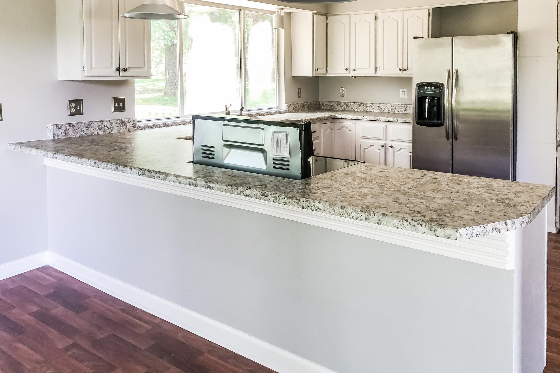 207 Independence Street Springfield, TN 37172 - Photo 14 of 25 a kitchen with granite countertop a refrigerator sink and stove