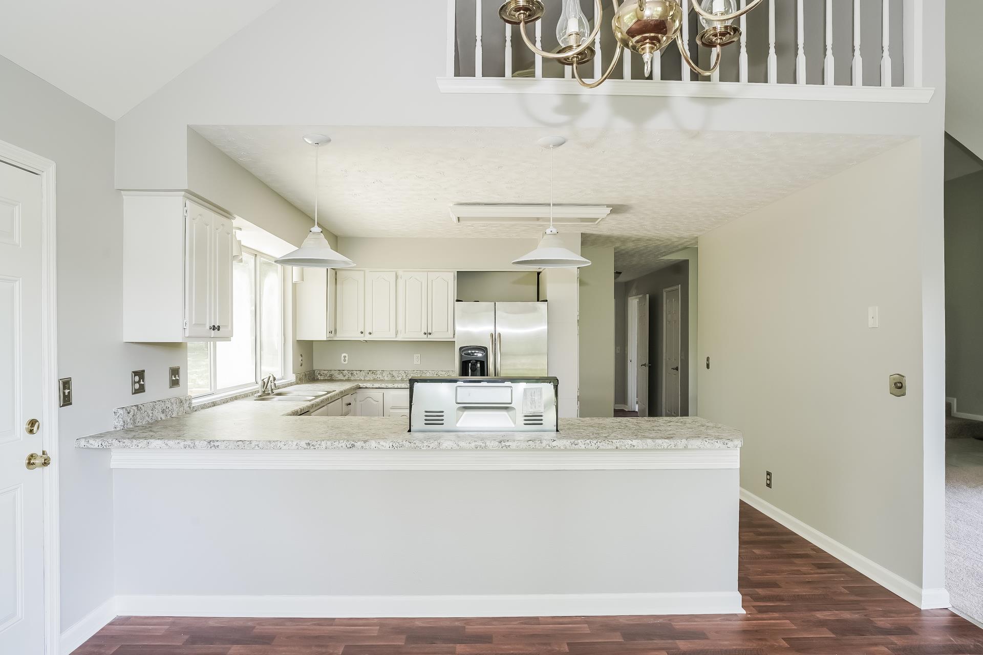 207 Independence Street Springfield, TN 37172 - Photo 16 of 25 a view of kitchen with kitchen island stainless steel appliances sink and cabinets